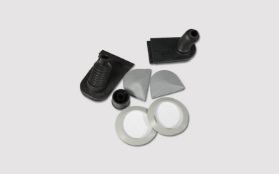 Gaskets with sealing and damping elements